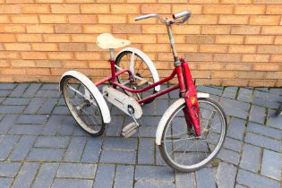 Raleigh - Walenkamp - A vintage Raleigh Winkie Tricycle in red and white which has the head badge H.