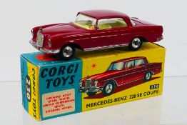 Corgi Toys - A boxed Corgi Toys #230 Mercedes Benz 220 SE Coupe.