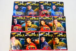 Hot Wheels - 12 x unopened carded Star Trek related vehicles,