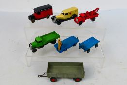 Dinky - A group of unboxed models including pre war Breakdown Lorry # 30e, Ambulance # 24a,