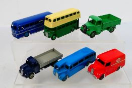 Dinky - A group of unboxed vehicles including Bedford truck # 25w, Trojan Esso van # 31a,