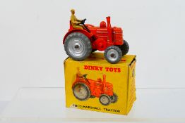 Dinky - A boxed Field Marshall tractor with silver wheel hubs # 301.