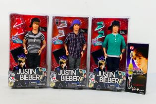 Bravado - 3 x unopened Justin Bieber dolls and a boxed Singing Toothbrush.
