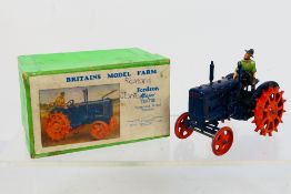 Britains - A boxed Britains Fordson Major tractor with spudded metal wheels # 127F.