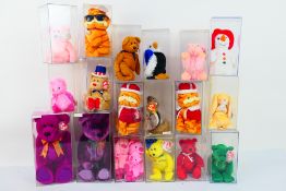 Ty Beanie Babies - Eighteen Ty Beanie Babies in plastic disply casesl.
