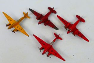 Dinky Toys - Four unboxed Dinky Toys model aircraft.