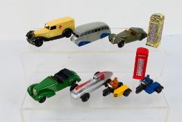 Dinky Toys - A group of unboxed Dinky Toys and Dinky Toy accessories.