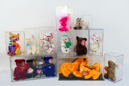 Ty Beanie Babies - Twenty-one Ty Beanie Babies in plastic display cases.