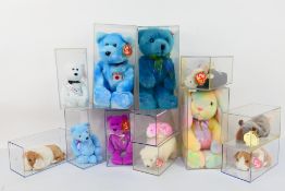 Ty Beanie Babies - Twelve Ty Beanie Babies in plastic display cases.