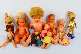 Rosebud - Fisher Price - BND - A group of vintage dolls including a jointed plastic bodied baby