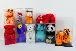 Ty Beanie Babies - Eleven Ty Beanie Babies in plastic display cases.