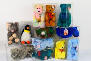 Ty Beanie Babies - Thirteen Ty Beanie Babies in plastic display cases.