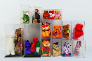 Ty Beanie Babies - Nineteen Ty Beanie Babies in plastic display cases.
