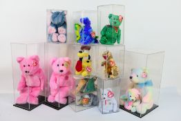 Ty Beanie Babies - Fourteen Ty Beanie Babies in plastic display cases.