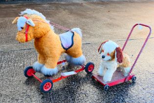 Two vintage unmarked children's push along toys, one of a Pony and one of a dog.