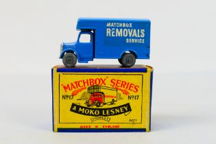 Matchbox - Moko Lesney - A boxed Bedford Removal van in blue with silver trim and metal wheels.