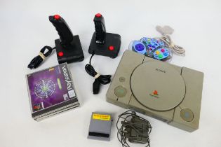Sony - An unboxed Sony Playstation console with game enhancer, adapter,
