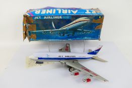 A boxed tin plate ME-087 battery operated aircraft model.