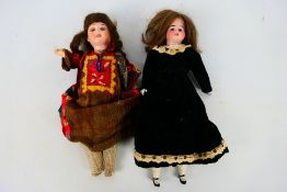 Dolls - Two unmarked vintage bisque headed dolls.