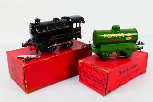 Hornby - A boxed clockwork O gauge locomotive and a boxed wagon.