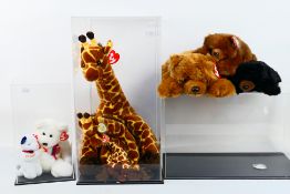 Ty Beanies - A menagerie of Ty Beanies housed within three perspex display case.