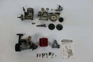 OS - Tamiya - Three unboxed nitro RC car model engines.