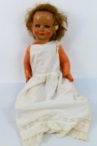 Porcelain Doll - An unbranded, vintage porcelain doll, painted, real hair, waking eyes,