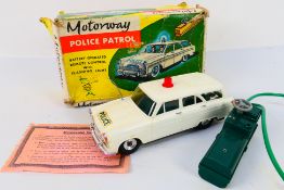 Louis Marx - A boxed 1960s Ford Zephyr Motorway Patrol car with flashing light.