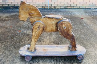 A vintage scratch built wooden horse.