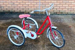 A vintage 1950s/60s childrens trike in the style of Raleigh.