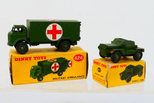 Dinky - 2 x boxed models, a Military Ambulance # 626 and a Military Scout Car # 673.