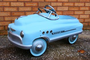 A children's pedal car in the manner of a 1950's 'Super Sport Comet'.