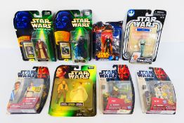 Star Wars - Hasbro - Disney - Eight carded Star Wars action figures from various series.