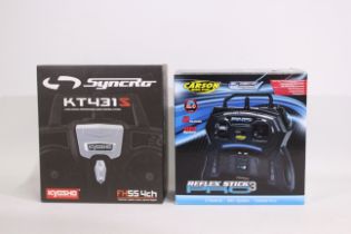 Kyosho - Two boxed RC control systems.