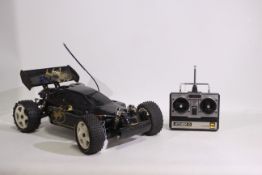 Kyosho - An unboxed Kyosho 1:8 scale nitro RC Turbo Burns Buggy.