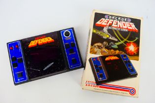 Entex - Arcade Defender - Williams. A boxed #6088 Arcade Defender, Electronic Game.