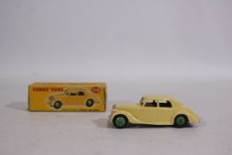 Dinky - A boxed Dinky Riley Saloon in the rarer cream body with green wheel hubs # 158.