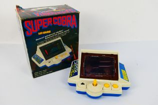 Konami - Gakken - Super Cobra. A boxed #7123 Super Cobra, LSI Game.