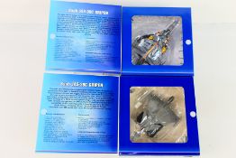Herpa - Two diecast 1:72 scale diecast Saab JAS-39C Gripen aircraft models.