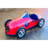A rare early 1950s pedal car believed to be based on a Maserati racing car and made by a low volume