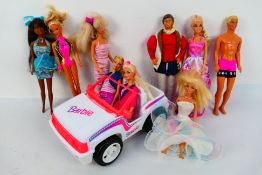 Mattel - Barbie - An unboxed Barbie Jeep, together with a group of nine unboxed Barbie dolls.