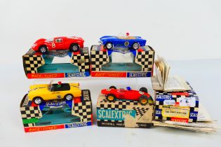 Scalextric - 4 x boxed vintage cars, a rare Sunbeam Tiger # C83, Triumph TR4A # C84,