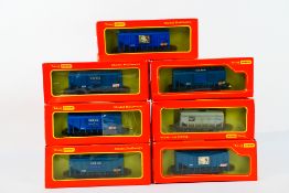 Tri-ang Hornby - 7 x boxed bulk grain wagons in OO gauge including VAT 69 and Johnnie Walker.
