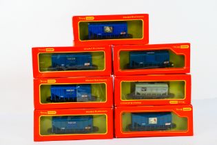 Tri-ang Hornby - 7 x boxed bulk grain wagons in OO gauge including VAT 69 and Johnnie Walker.