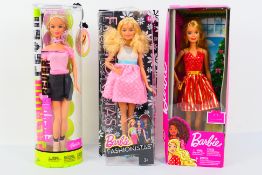 Barbie - Mattel - Three boxed Barbie dolls from Mattel.