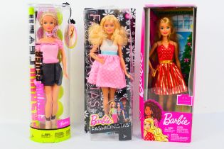 Barbie - Mattel - Three boxed Barbie dolls from Mattel.