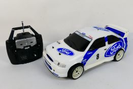 Kyosho - An unboxed Kyosho 1:10 scale nitro RC QRC Ford Escort WRC.