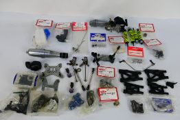 Kyosho - An unboxed Kyosho GZ nitro engine with a quantity of loose parts and some parts in sealed