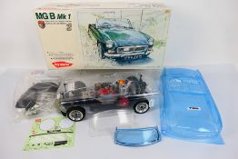 Kyosho - Teambluegrove - A Kyosho 1:10 scale RC MGB Mk.I with a boxed Teambluegrove bodyshell.