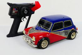 Tamiya - Kyosho - A 1:10 electric RC 'Rover Mini Cooper'.